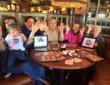 Image of family around the table for rare disease day