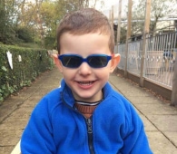 Boy with sunglasses smiling
